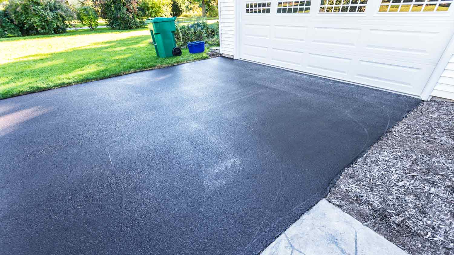 Newly laid asphalt driveway drying