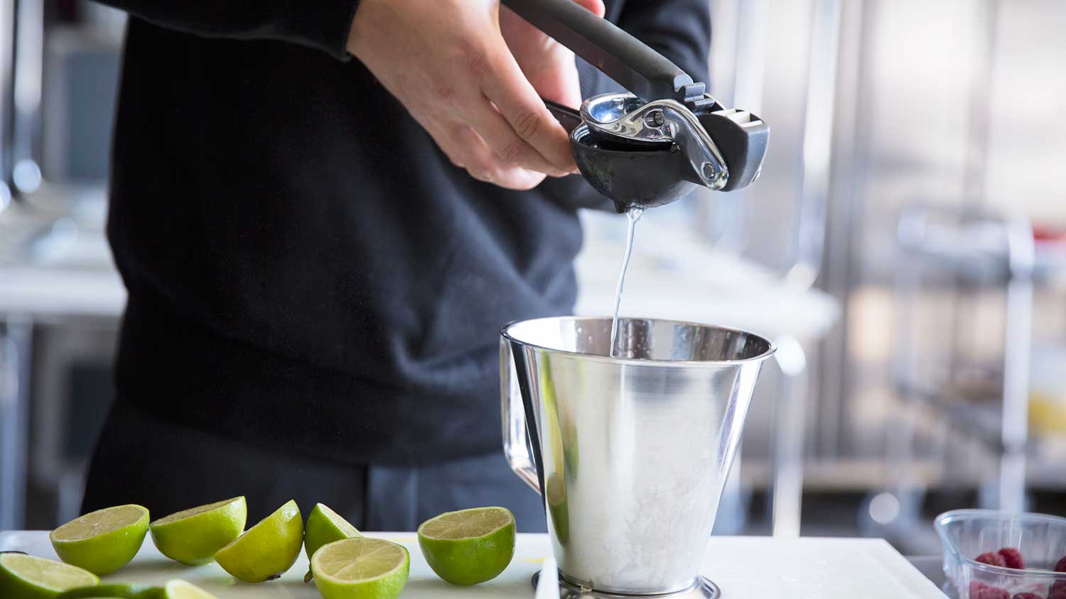 Man using manual lime squeezer