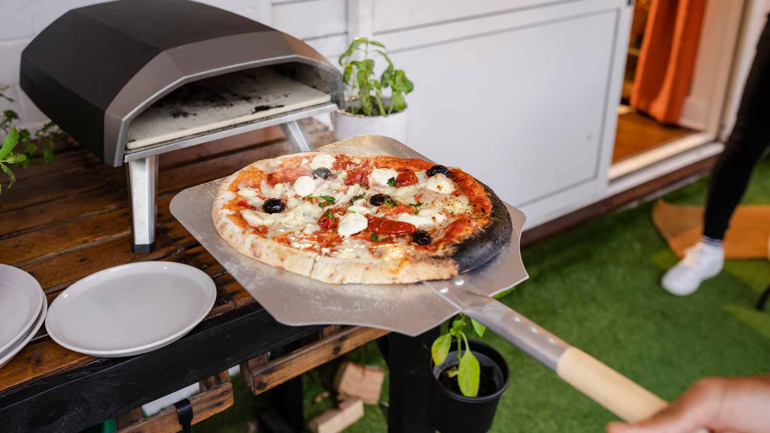 Freshly cooked pizza in an outdoor oven