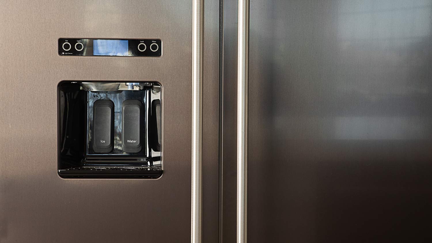 water dispenser and ice maker on fridge