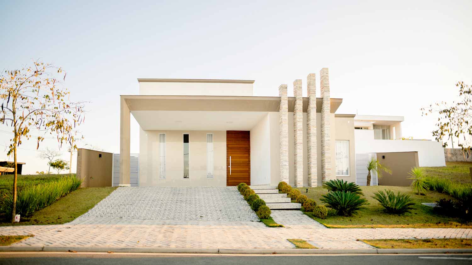 The front facade of a contemporary house with a driveway