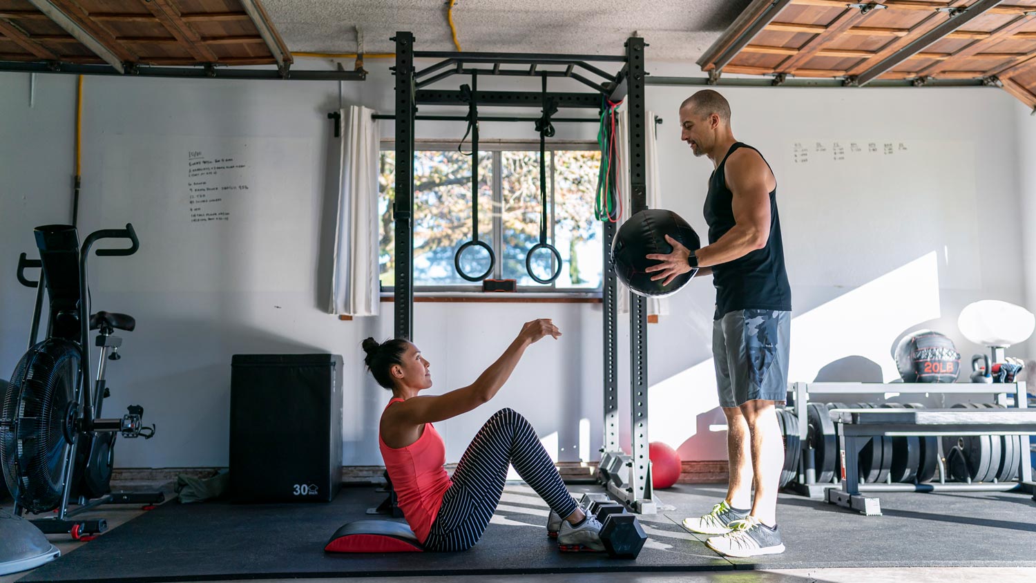 Couple working out in a garage-turned-into-a-home-gym