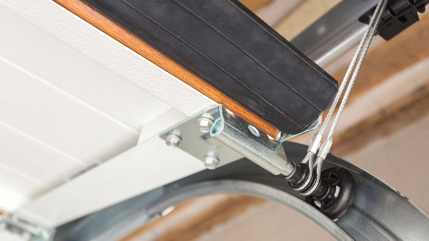Close up of a garage door cable system