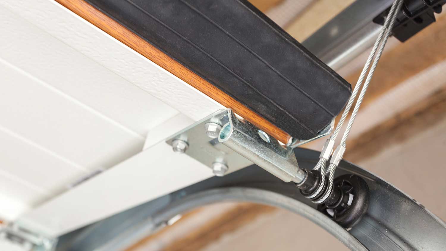 Close up of a garage door cable system 