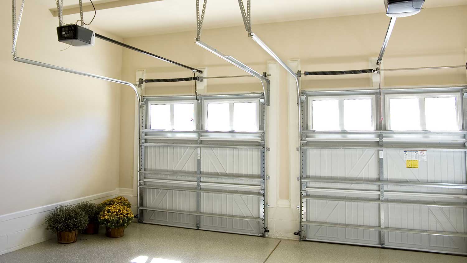 Residential garage interior with two automatic doors 