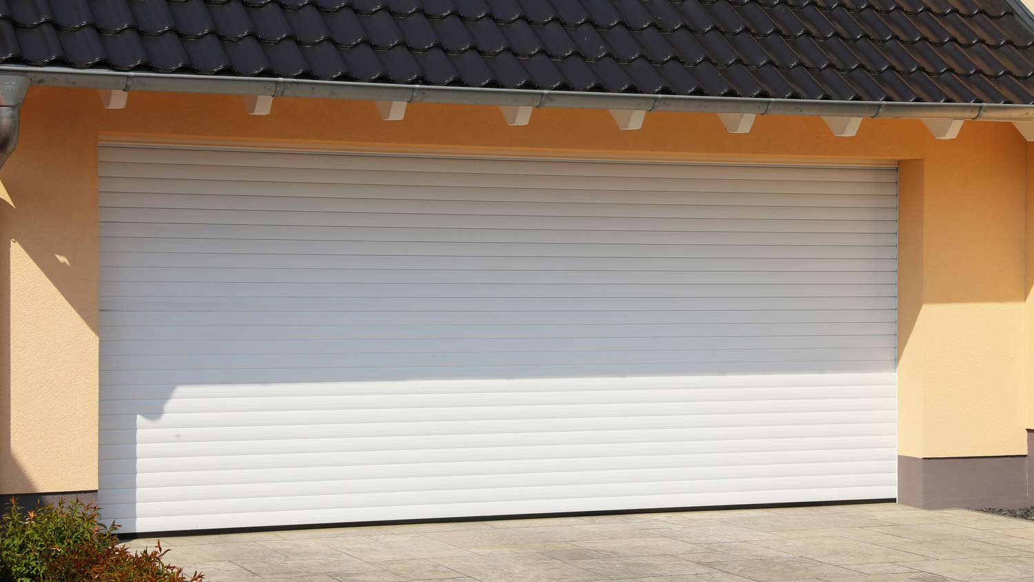 garage with with white roll up door