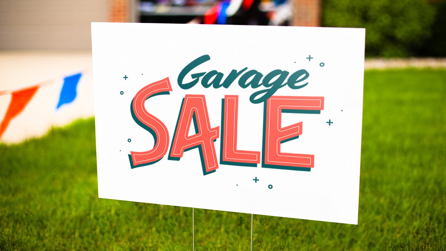 garage sale sign in front yard grass