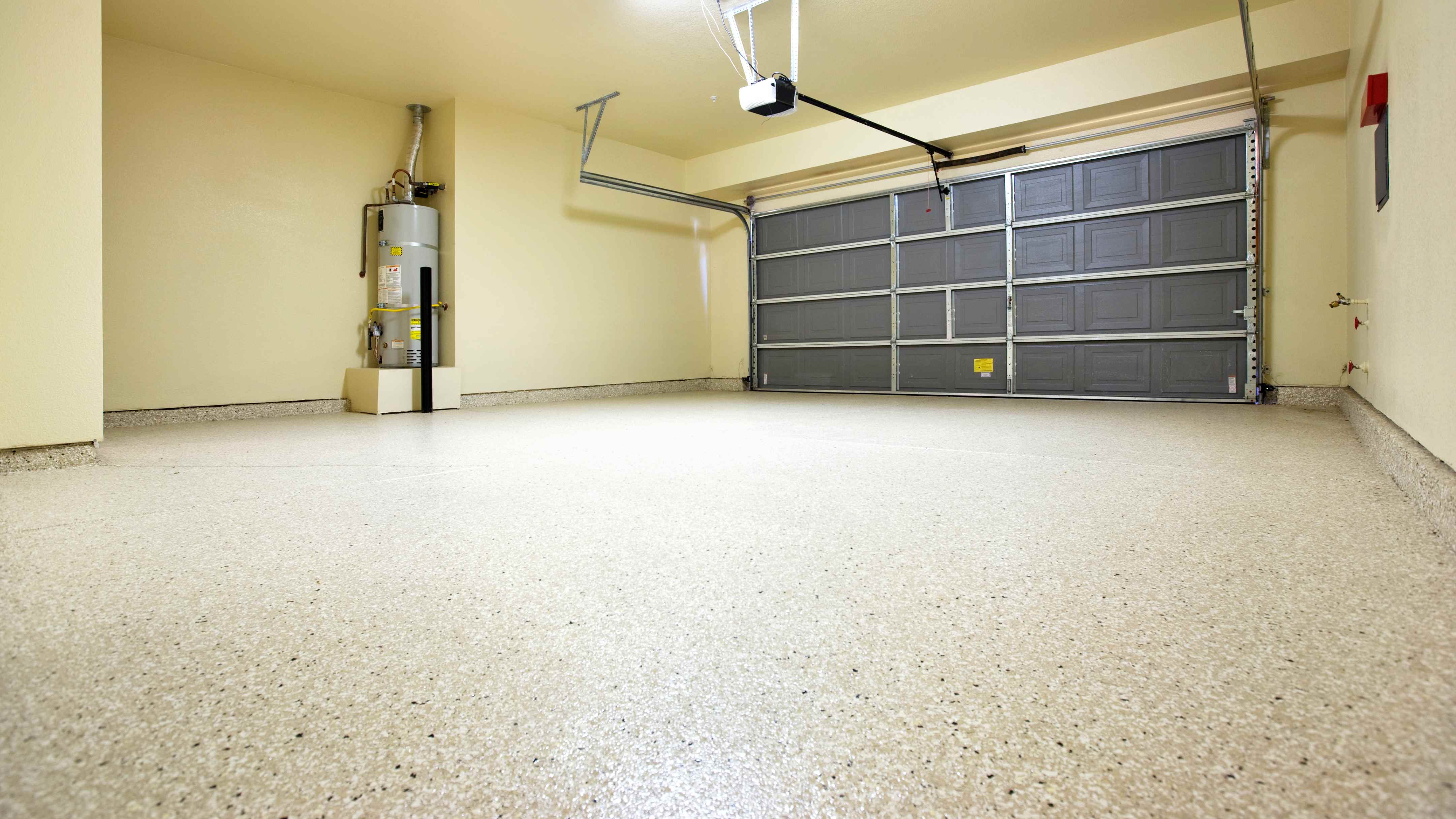 Empty garage interior with epoxy flooring 