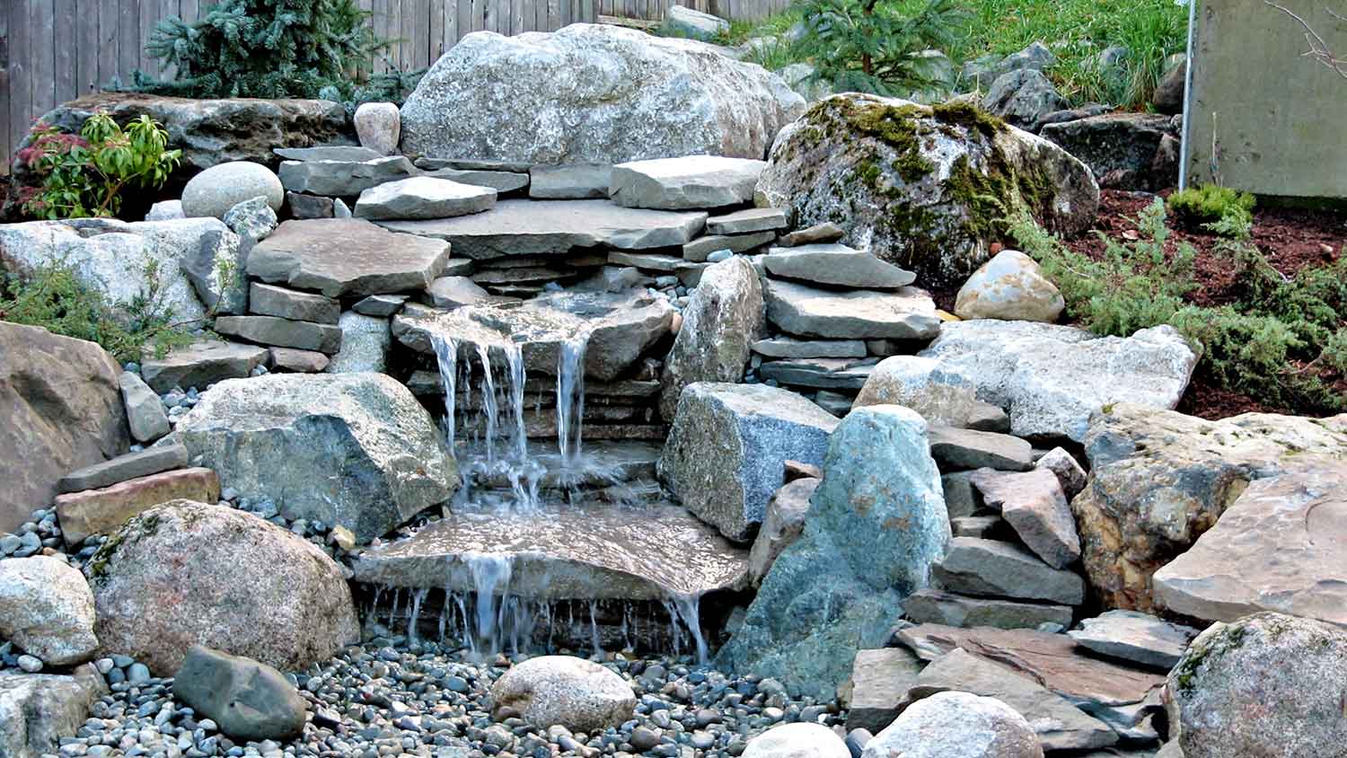 Boulders used to build a waterfall in the yard