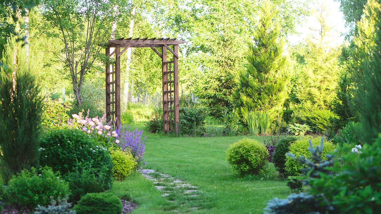 Garden with arbor and stone pathway