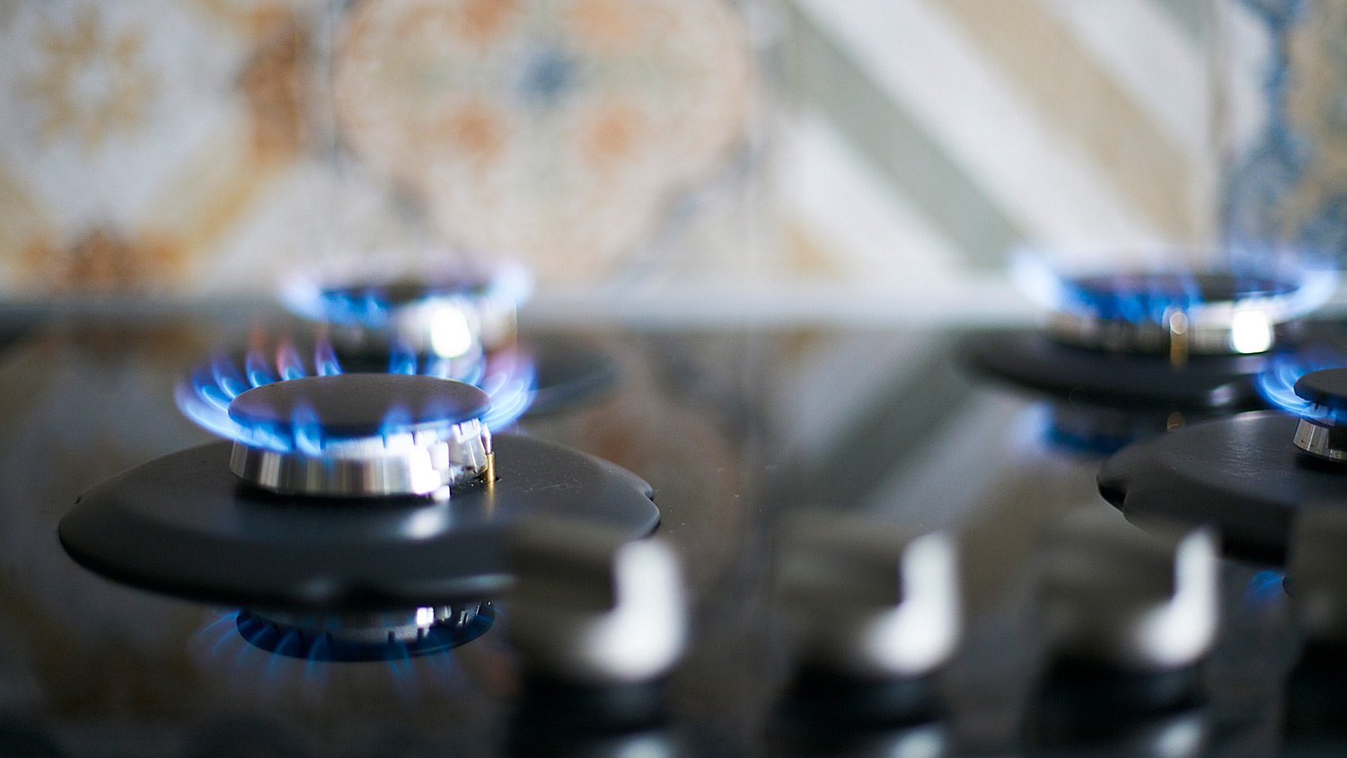 lose-up Natural Gas Stove Burner Appliance with Blue Flame Fire