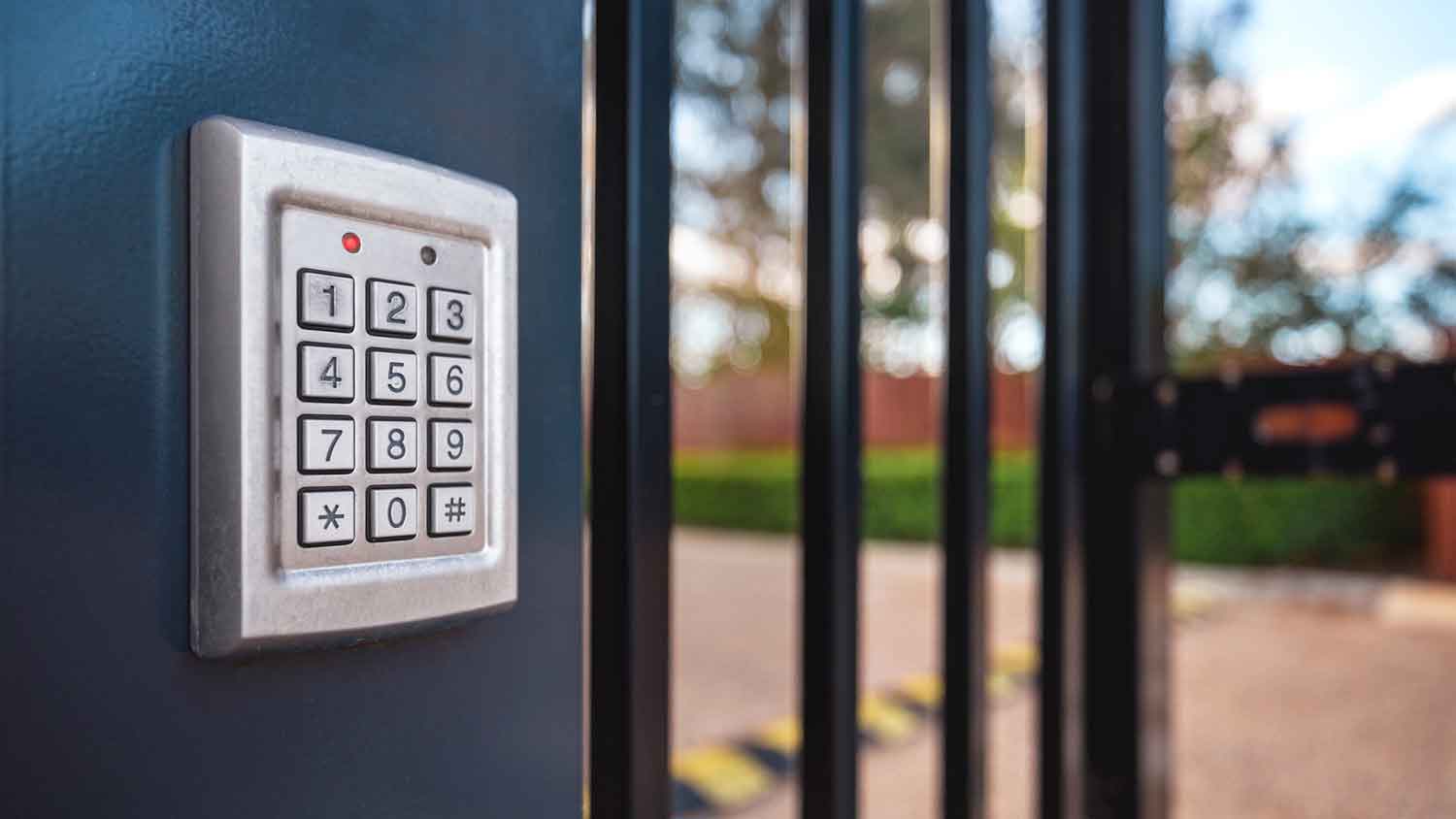 Automatic gate keypad mounted on the exterior wall 