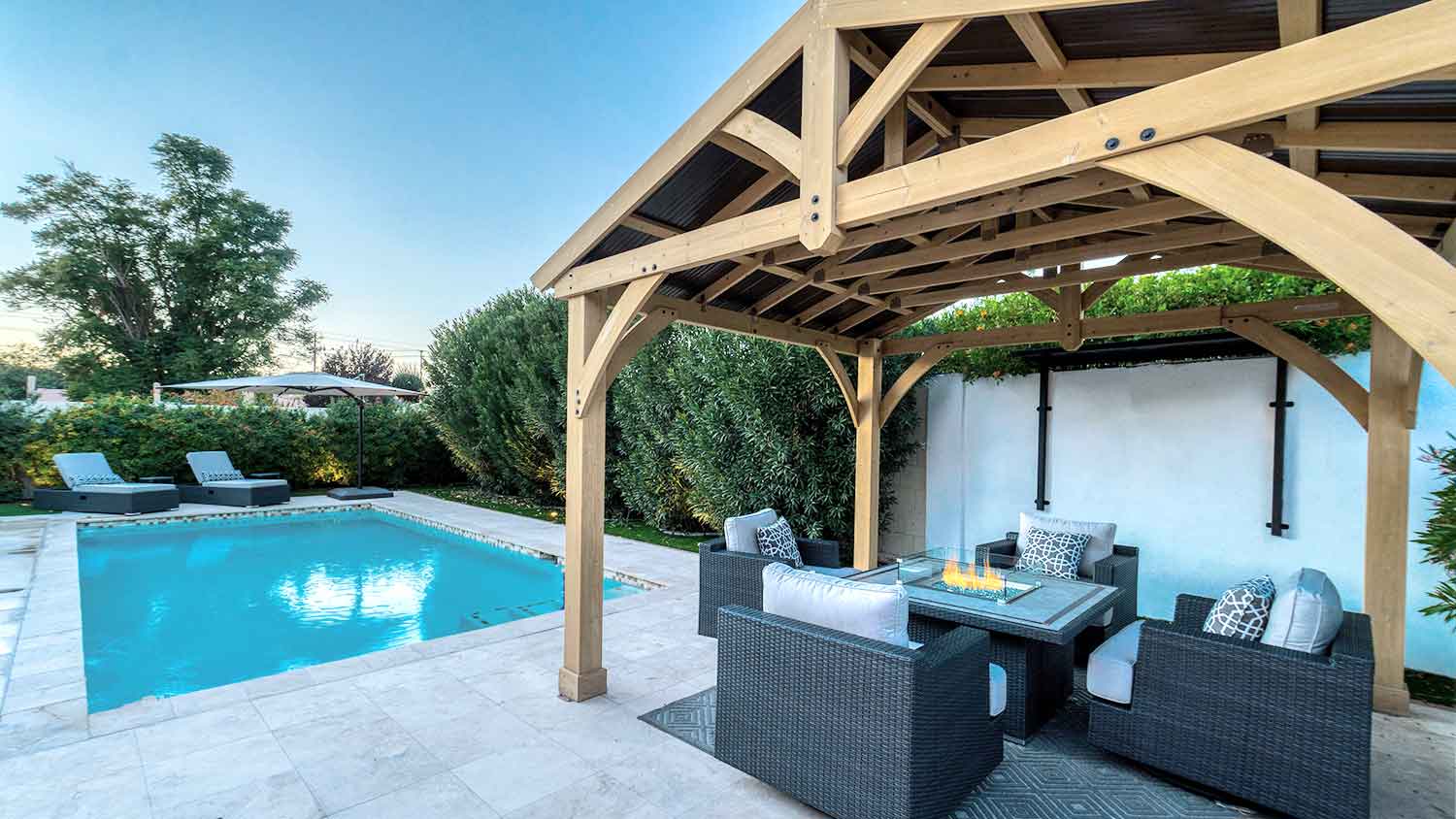 Swimming pool area with gazebo and outdoor furniture