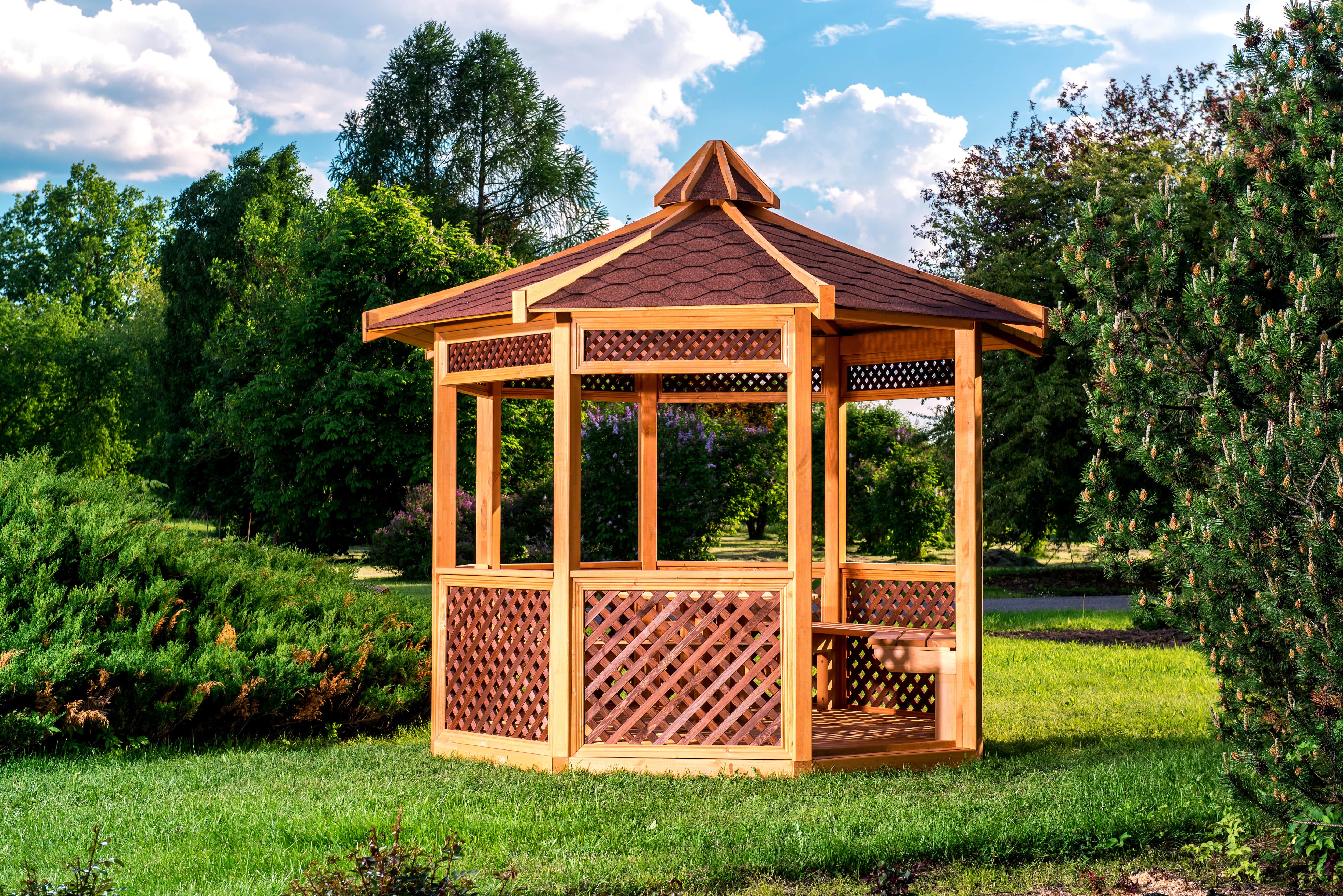 Two-toned wooden gazebo in yard