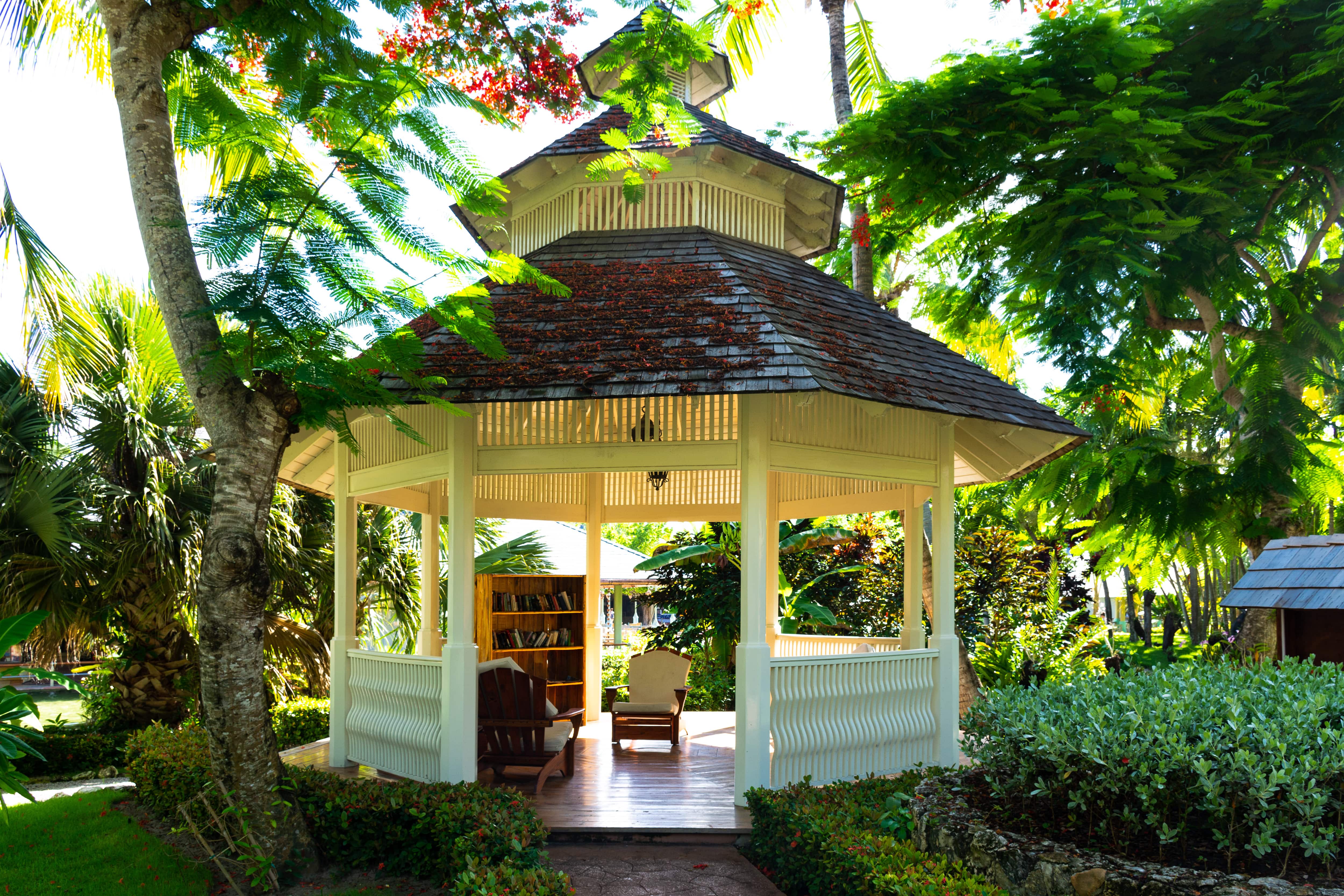 Gazebo with lounge chairs and bookshelf