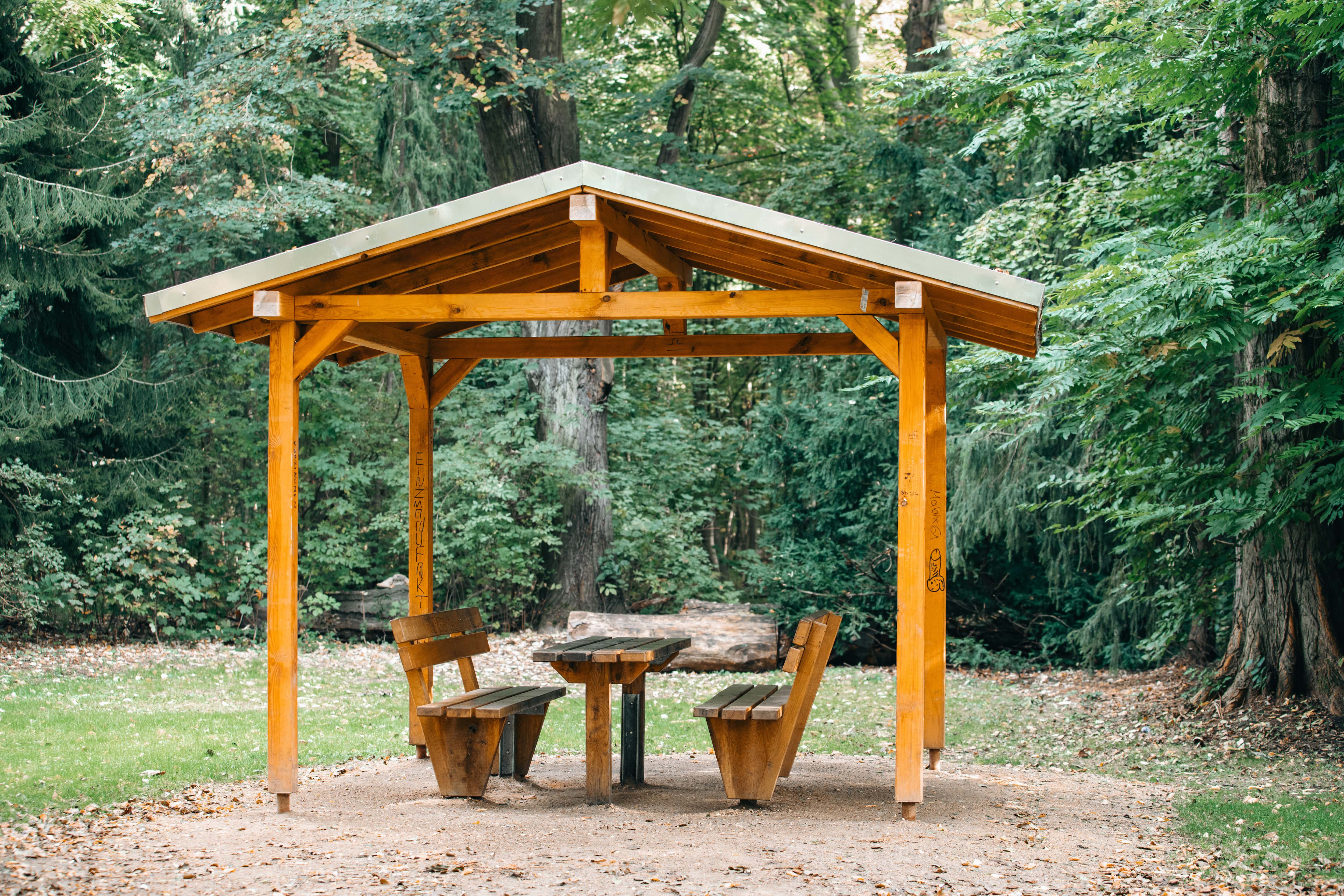 Wooden gazebo with gable roof