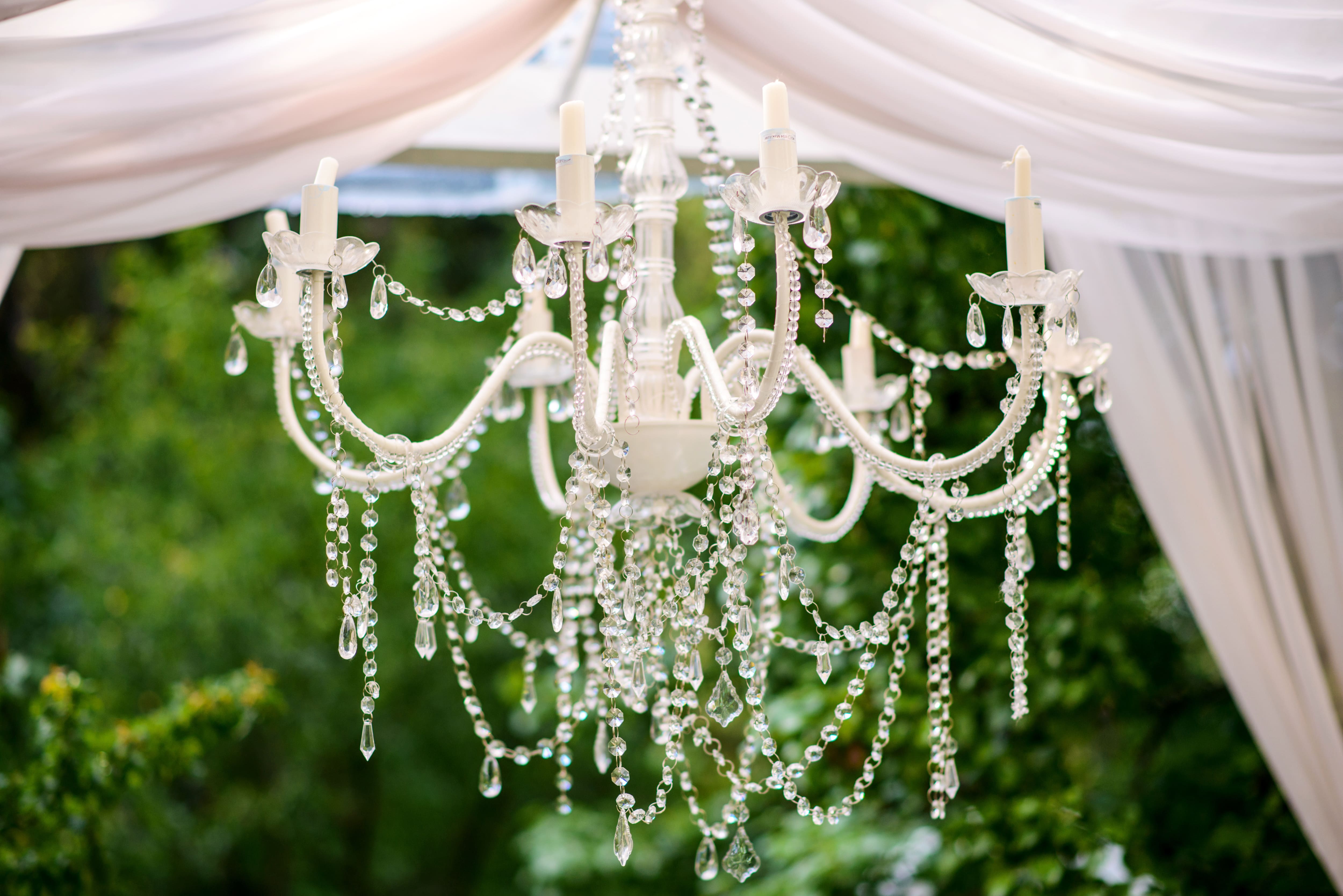 White chandelier hung in gazebo