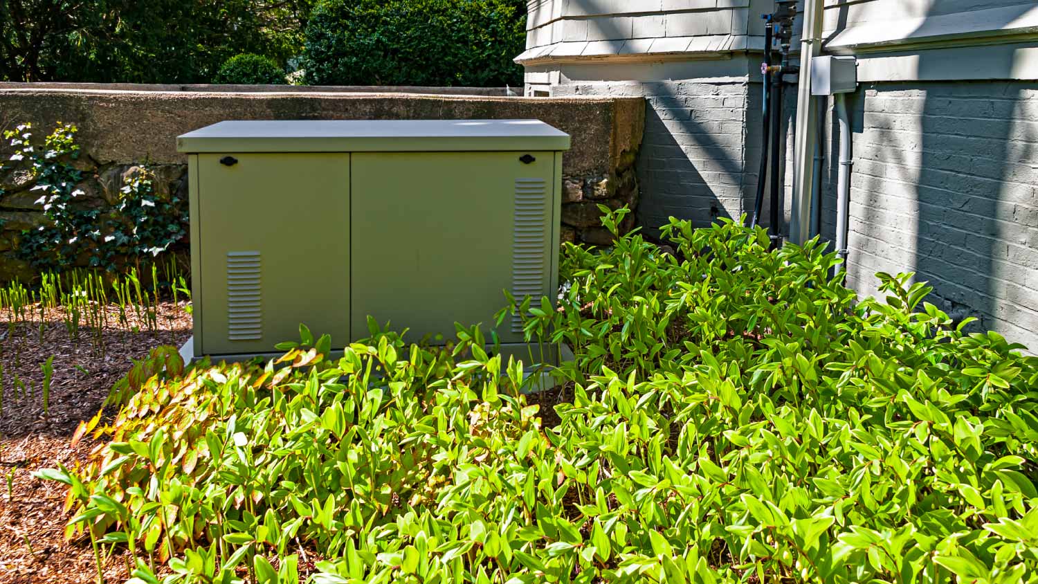 Generator installed on a concrete pad 