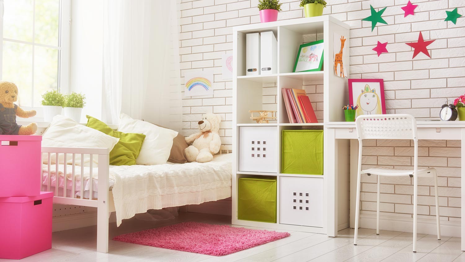 A girl’s bedroom with plenty of storage next to her desk