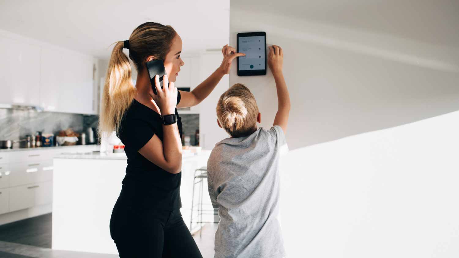 Girl talking on phone using digital tablet