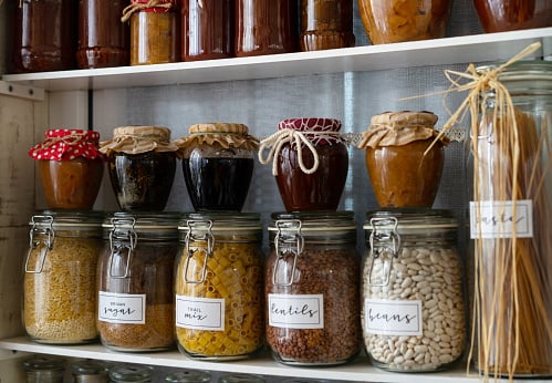 Food storage jars sitting on shelves