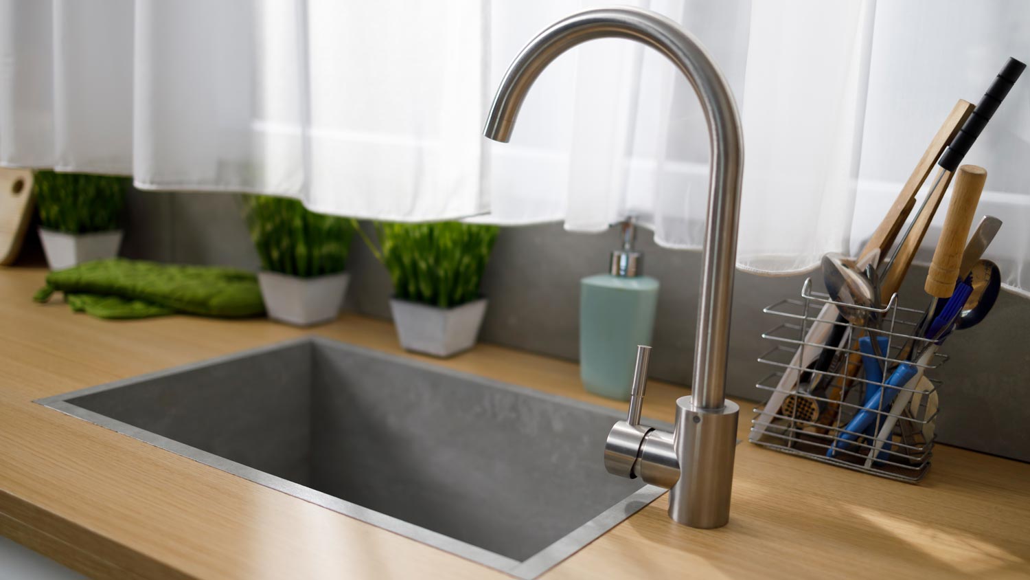 kitchen faucet with gray quartz sink 