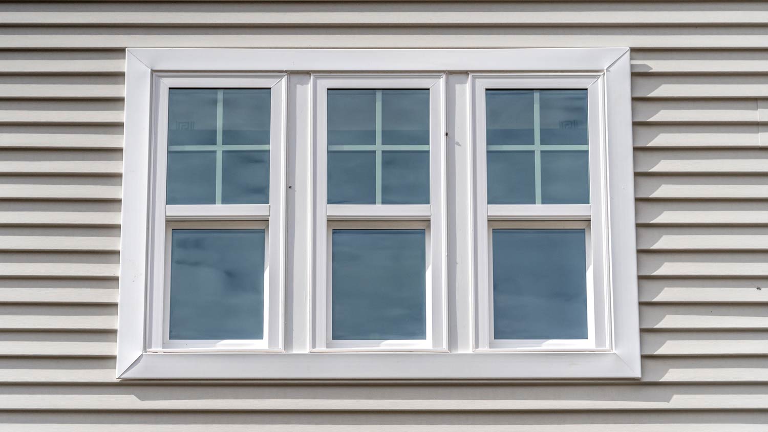 grey house with vinyl windows