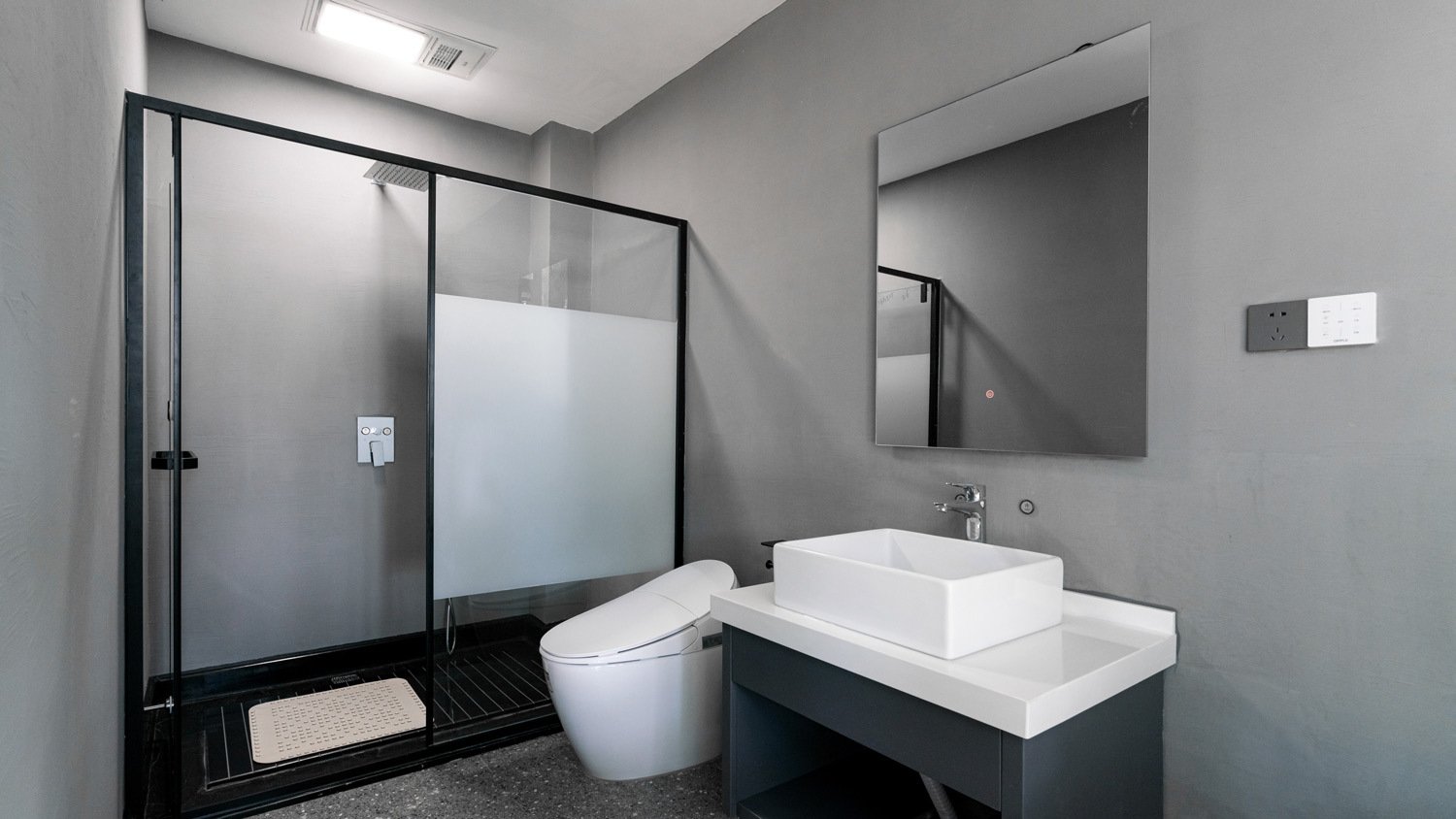 Modern bathroom with grey paint