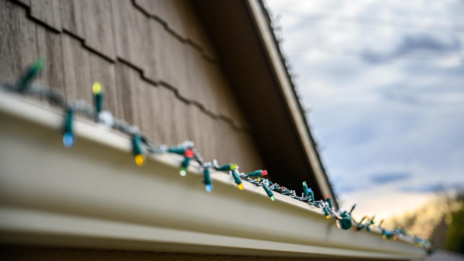 Hanging Christmas Lights Gutter 310930952 ?impolicy=leadImage