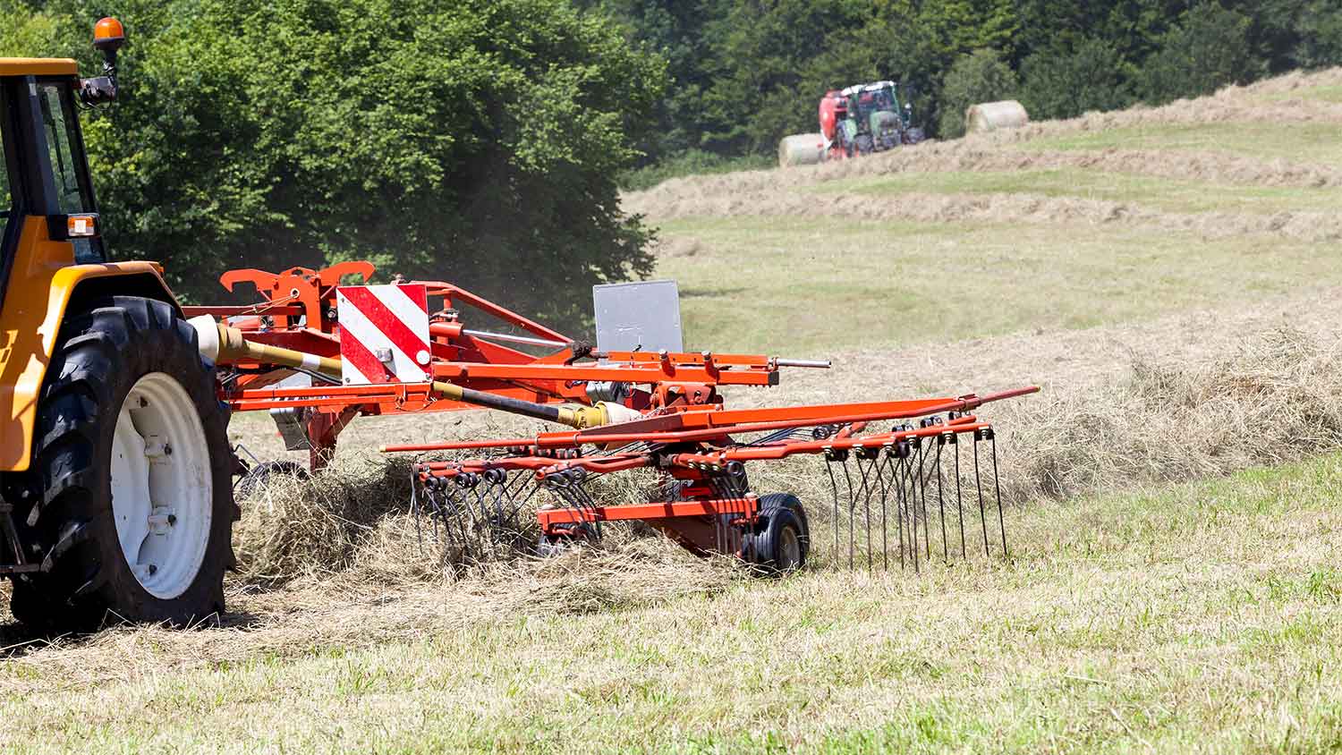 A hay rake on a tractor