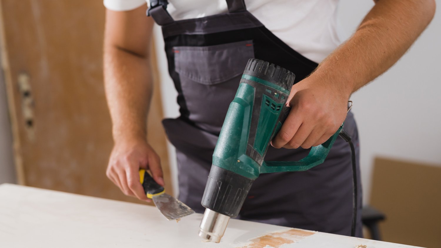 Man using heat gun