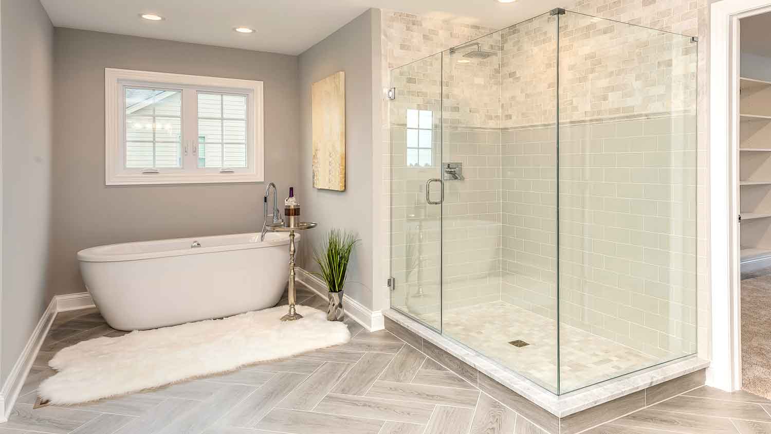 Hinged shower door installed in a master bathroom