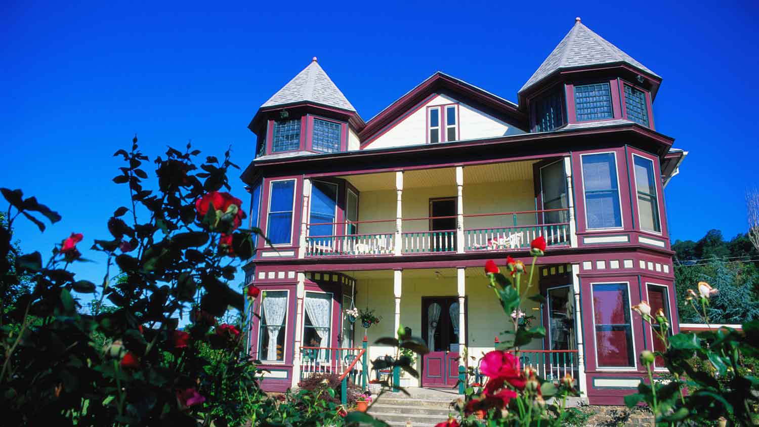 Historic house exterior painted dark plum