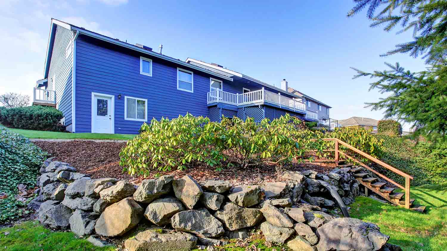 house with rich blue vinyl siding