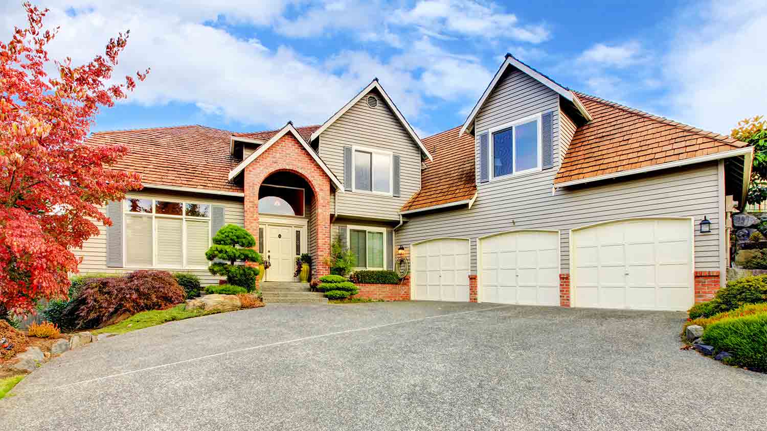 large home with cedar roof