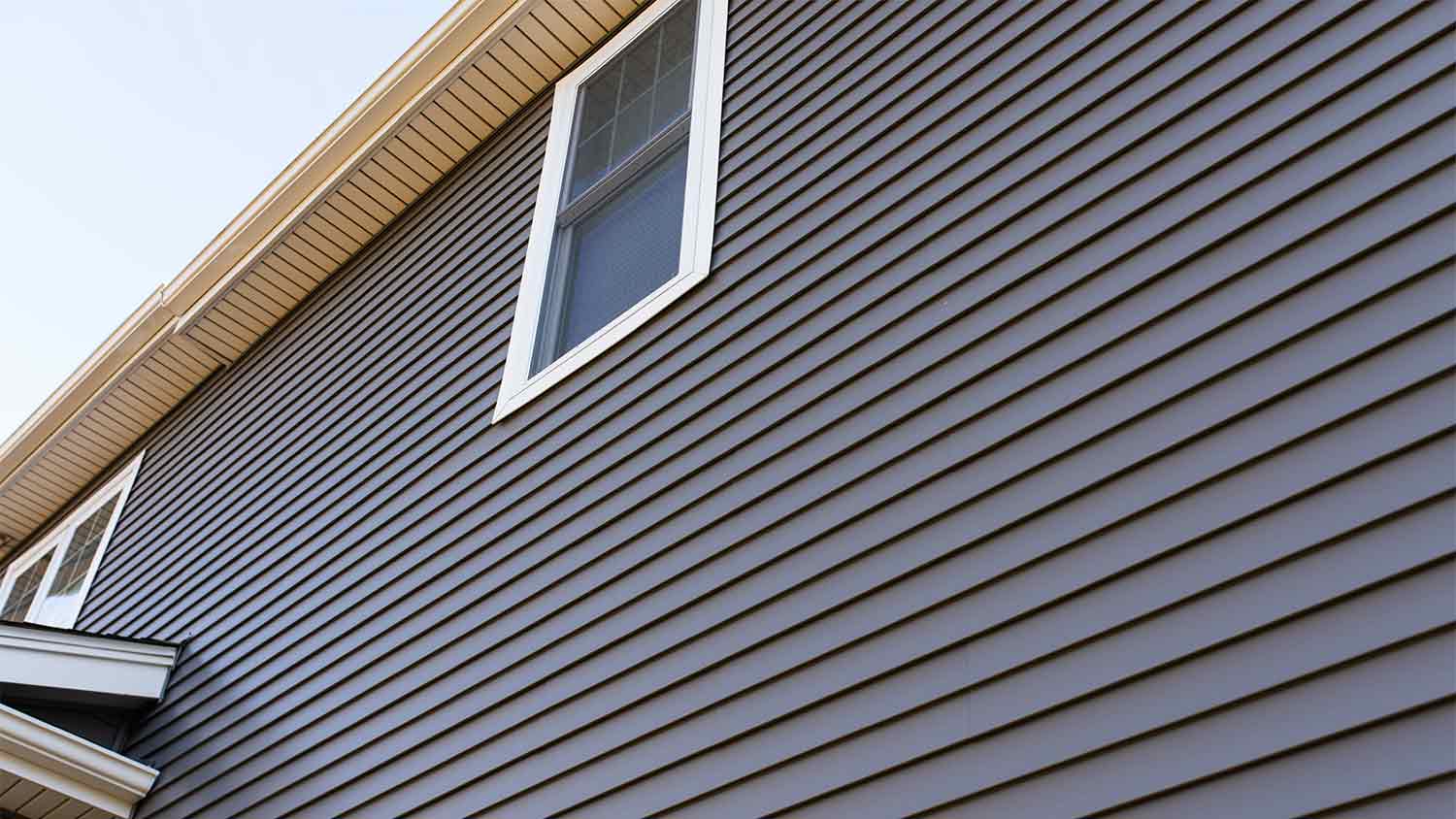 house with charcoal gray vinyl siding