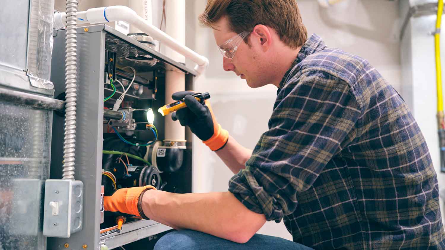 Inspector evaluating home furnace