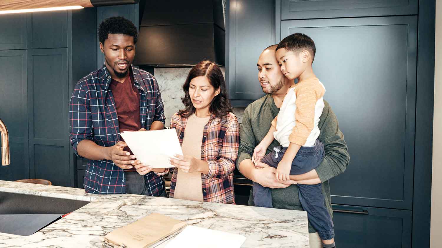 Home inspector showing inspection results to a family