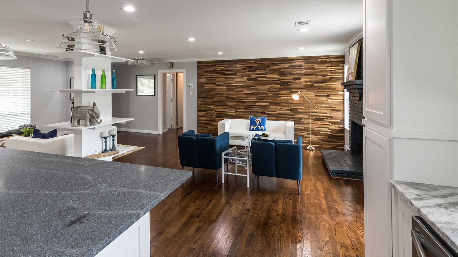 A view of a home interior with a wood accent wall