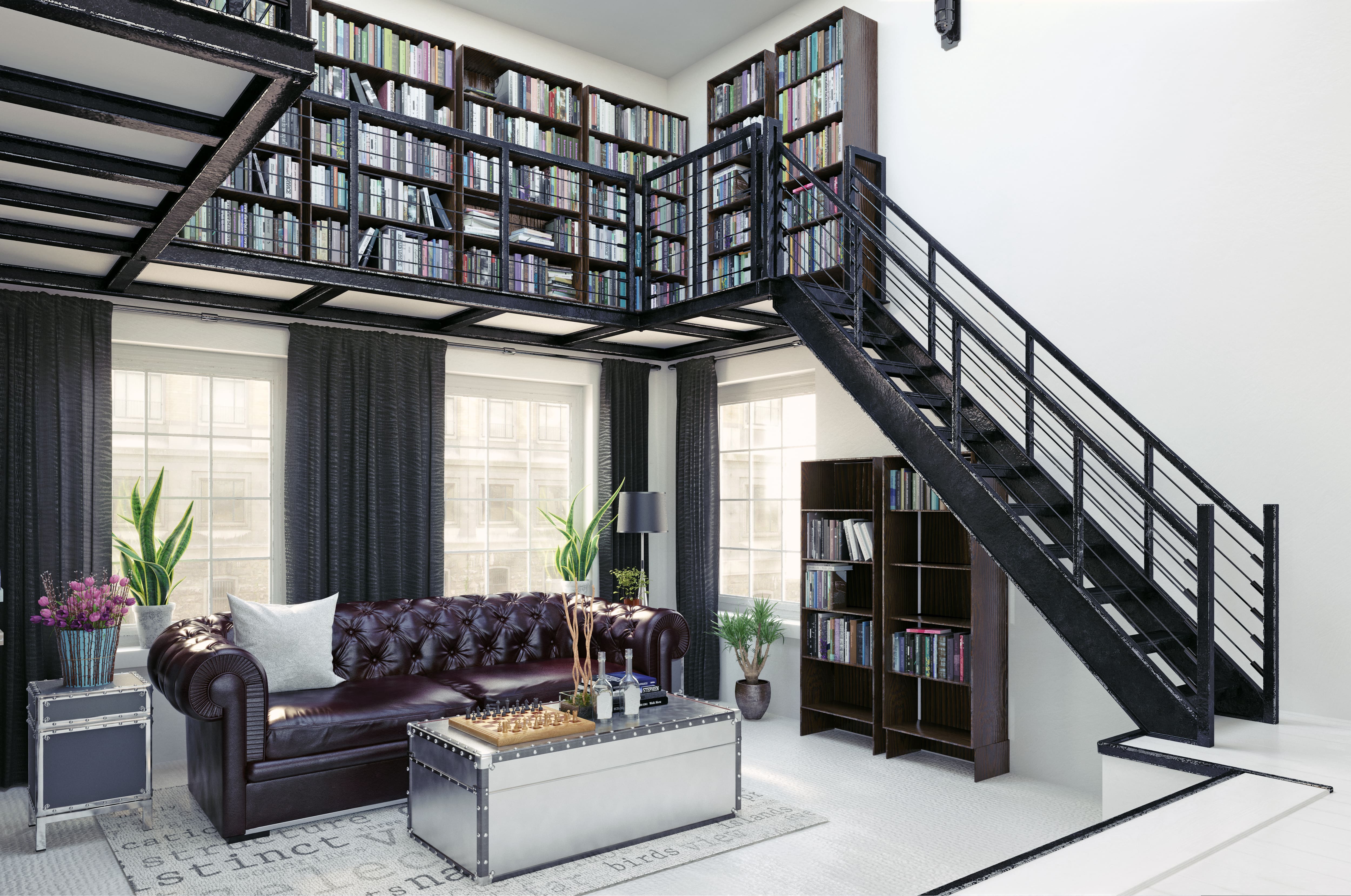 Modern loft with black bookshelves and living room space below 