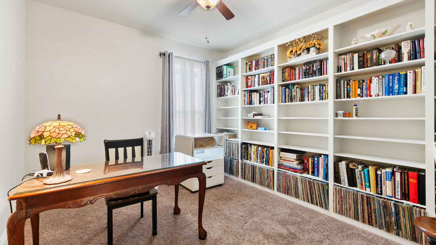 A home office with built-in bookshelves