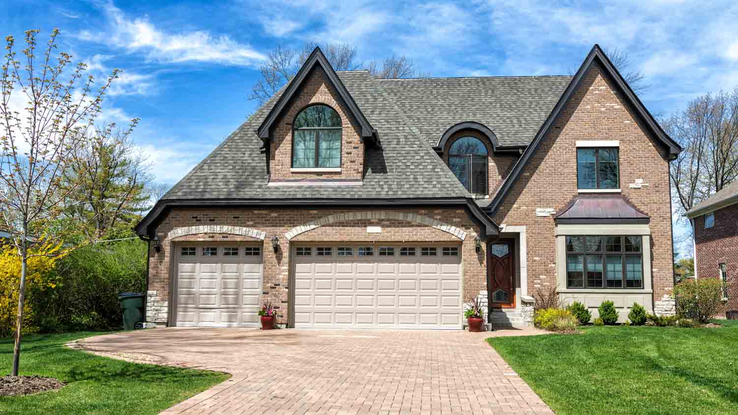 traditional home with pavement driveway