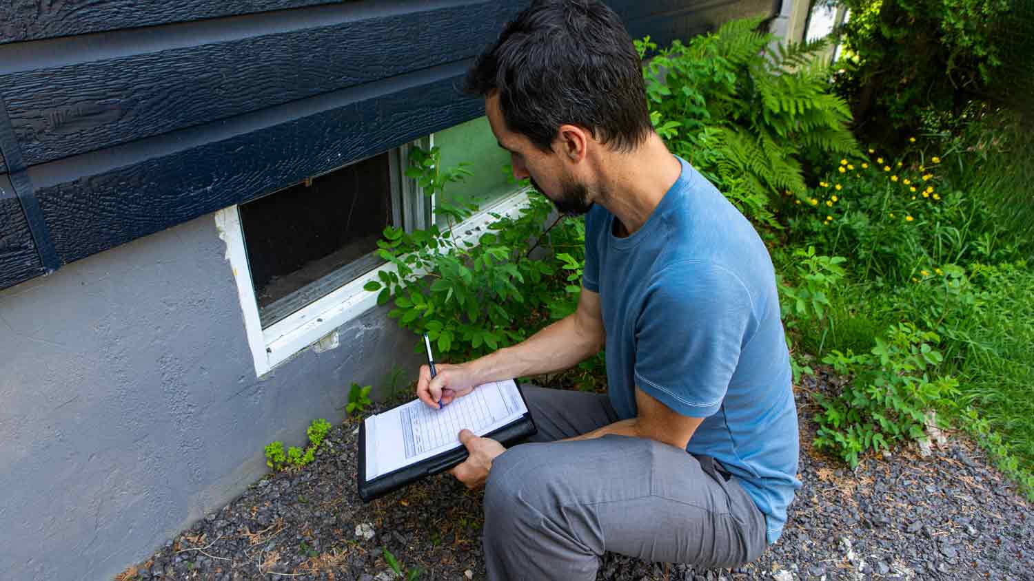 home quality inspector taking notes