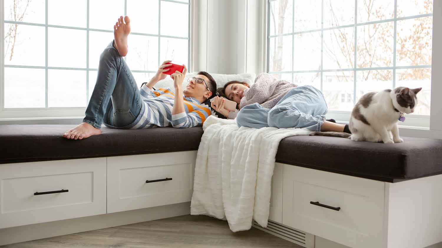 Young couple relaxing in a reading nook