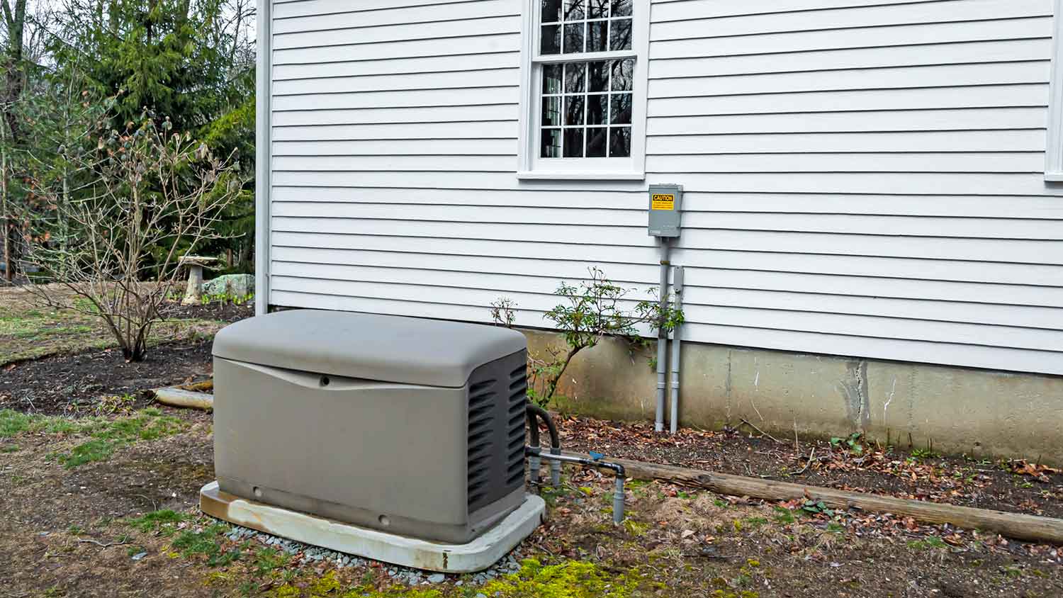 Home standby generator sitting on concrete pad