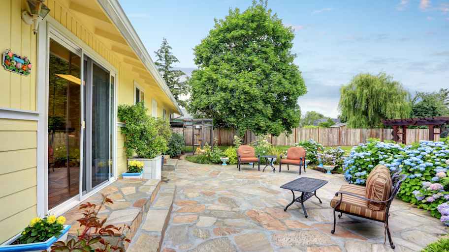 home with stone patio