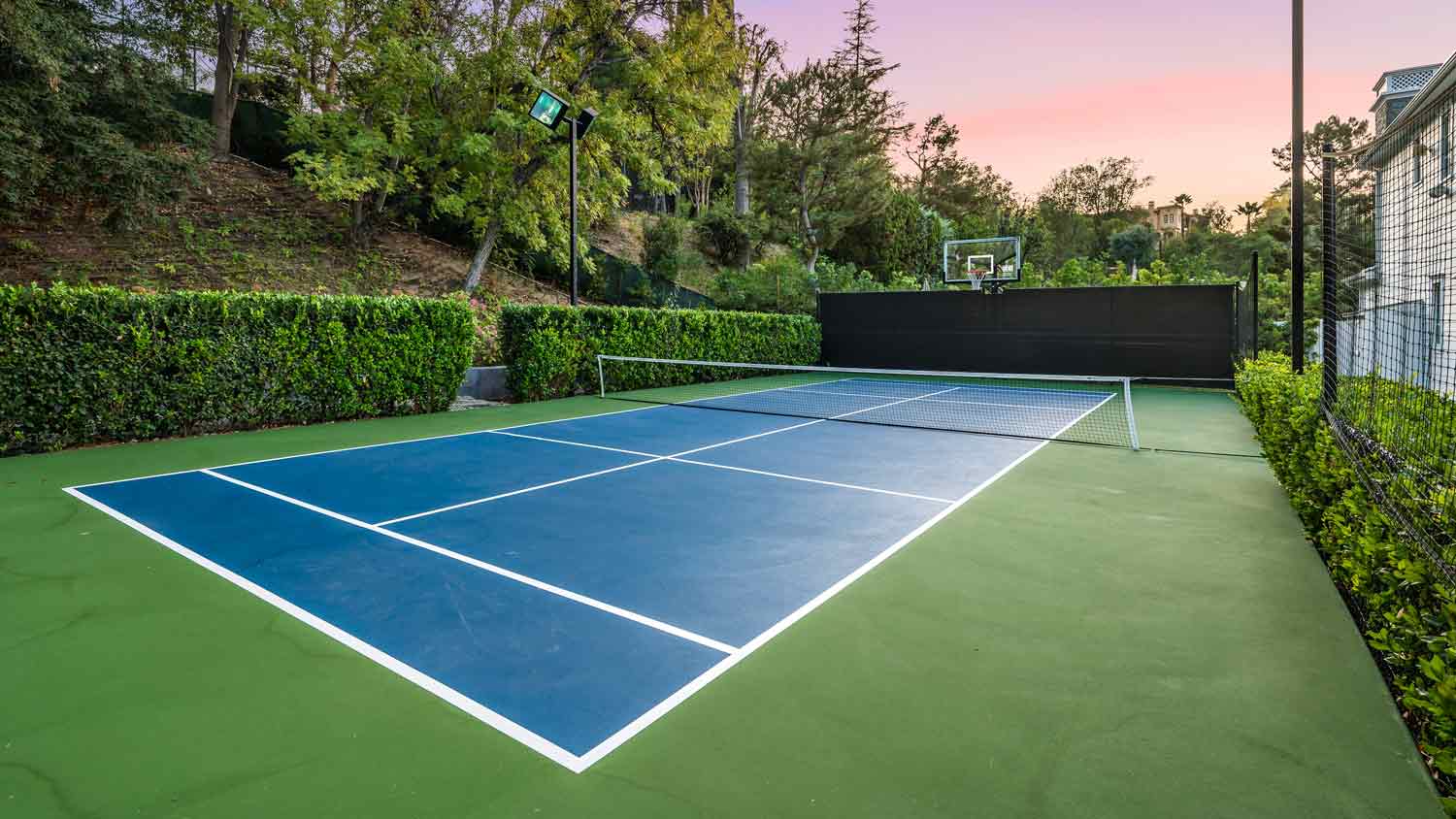 home tennis court at night