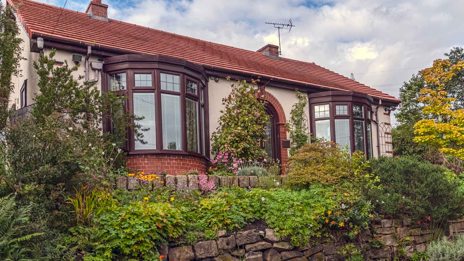 Home exterior with circle bay windows