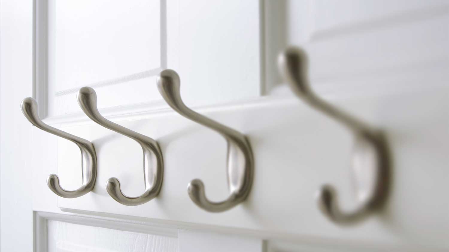 Door hooks mounted on a white door