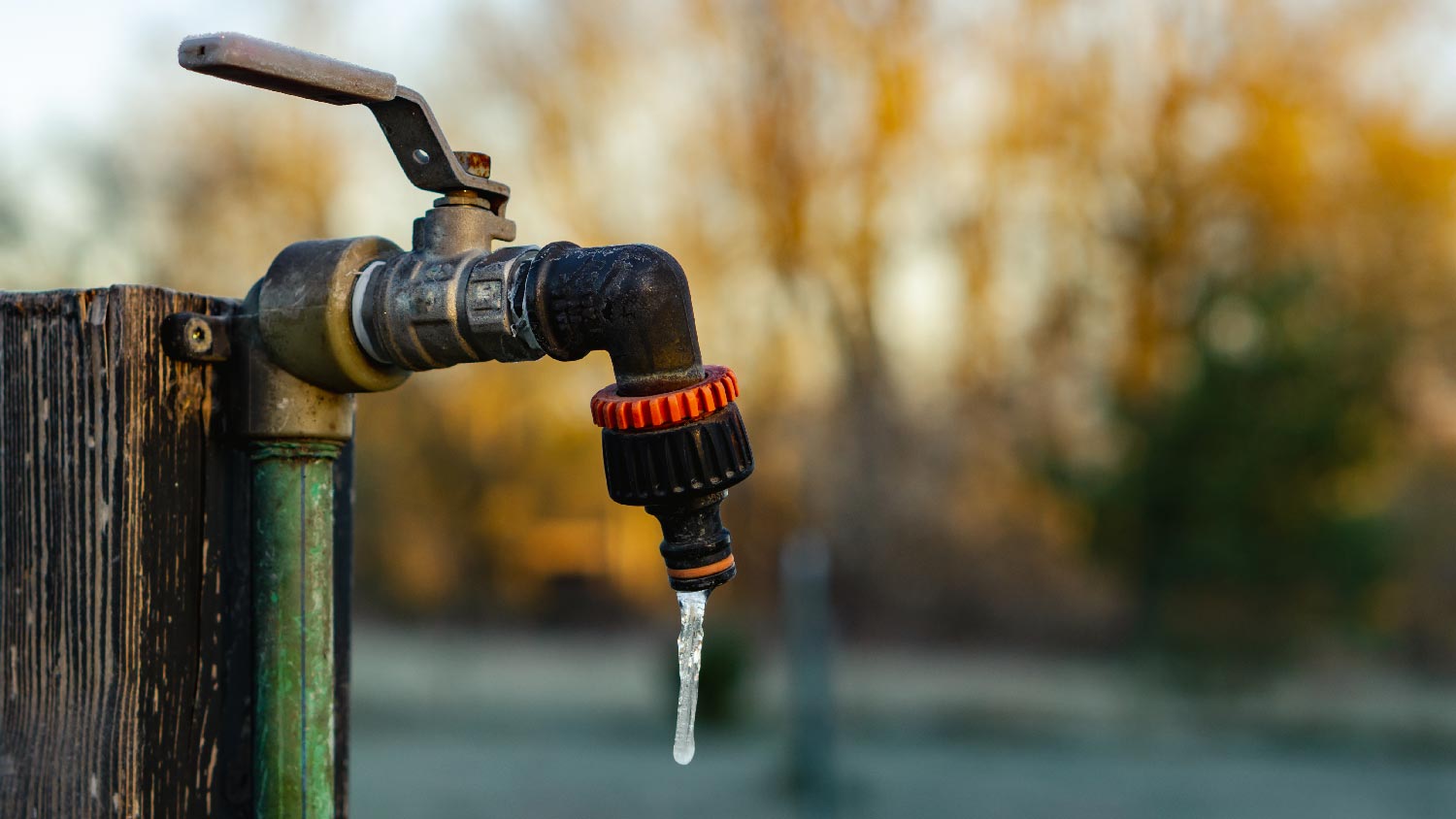 A hose bib with a frozen water drop